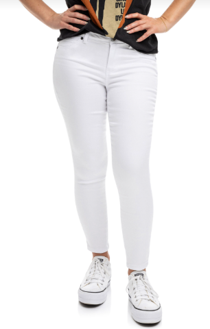 Person wearing white jeans and white sneakers on a white background