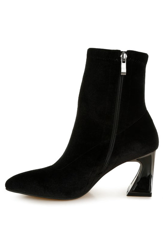 Black ankle boot with a zipper on a white background
