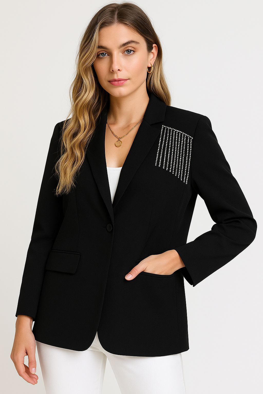 Woman wearing a black blazer with a decorative pocket on a white background