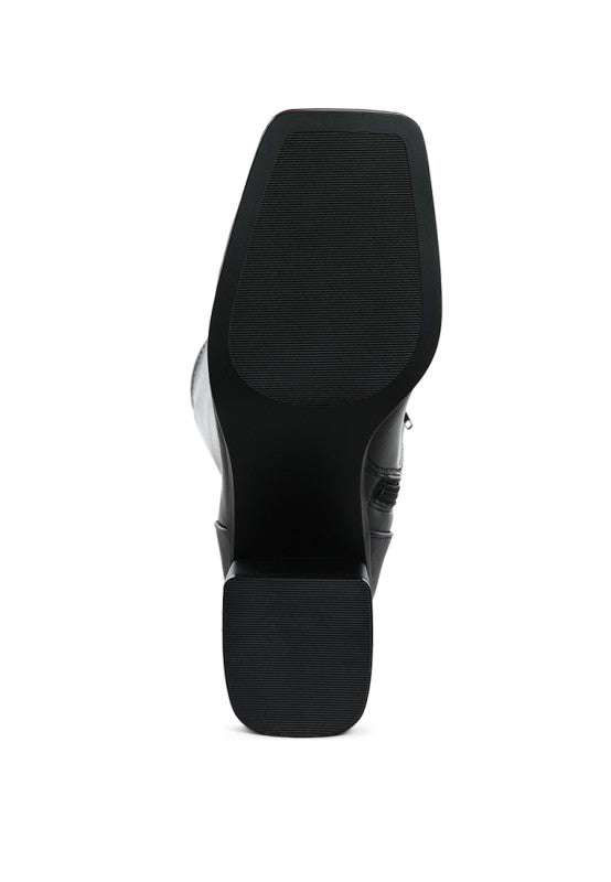 Black high-heeled shoe sole on a white background