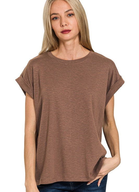 Woman wearing a brown t-shirt on a white background