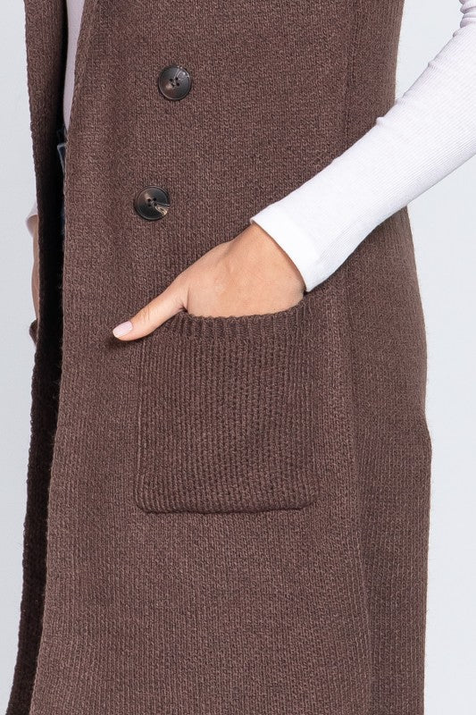 Brown knitted vest with button details on a white background