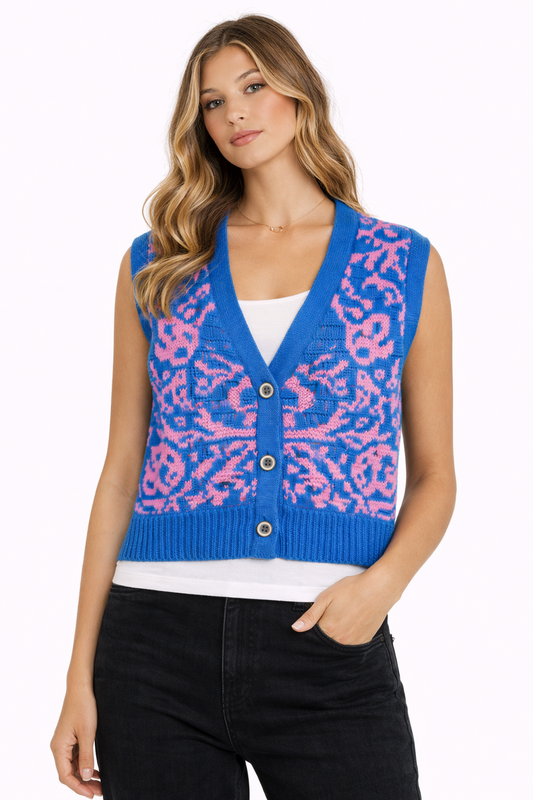 Woman wearing a blue and pink patterned vest on a white background