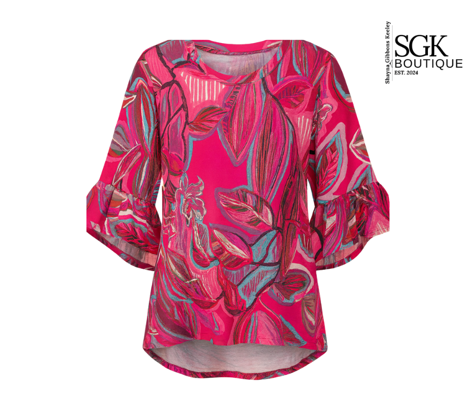 Pink floral patterned top with SGK Boutique branding on a white background