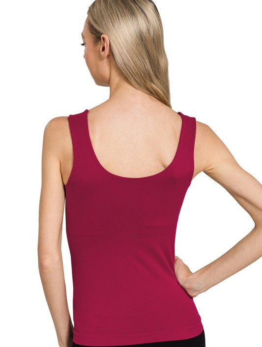 Person wearing a cabernet tank top on a white background