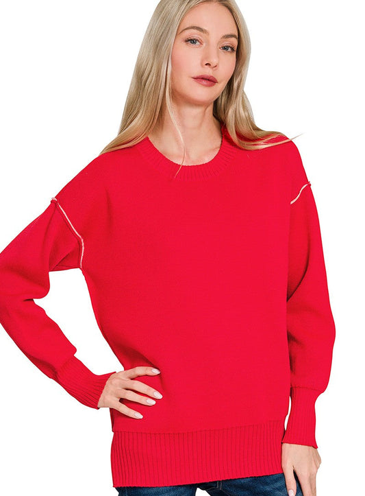Woman wearing a red sweater on a white background