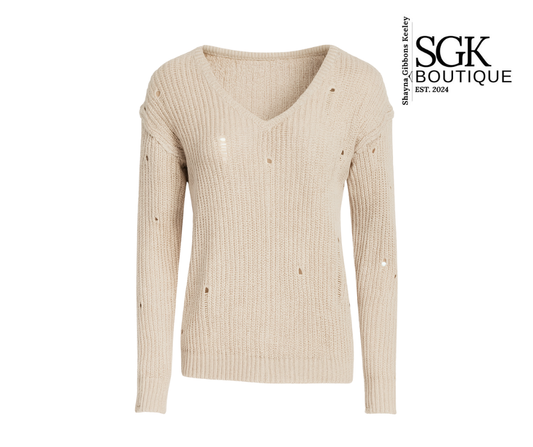 Beige ribbed sweater with button details on a white background, featuring SGK Boutique logo.