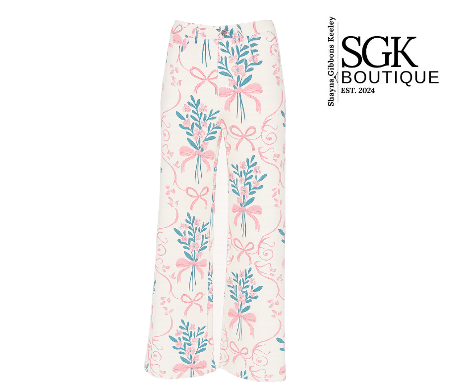 Floral and bow-patterned pants with SGK Boutique branding on a white background