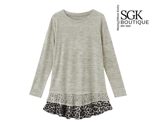 Gray long-sleeve dress with leopard print hem on a white background, featuring SGK Boutique branding.