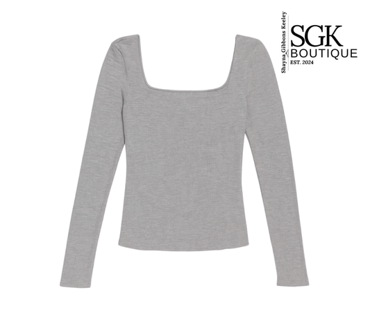 Gray long-sleeve top on a white background with SGK Boutique branding.