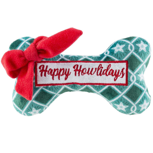 Dog toy shaped like a bone with a red bow and 'Happy Howlidays' label on a white background