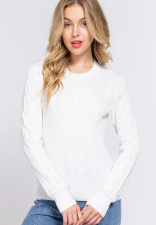 Woman wearing a white sweater and blue jeans on a light gray background