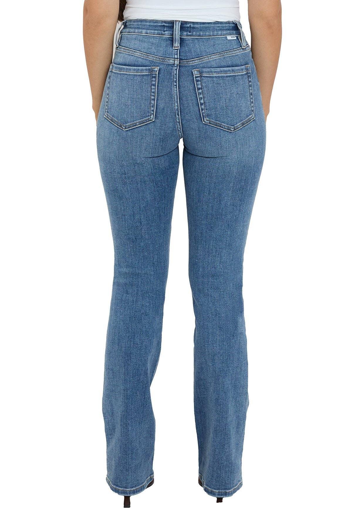 Blue jeans worn by a person on a white background