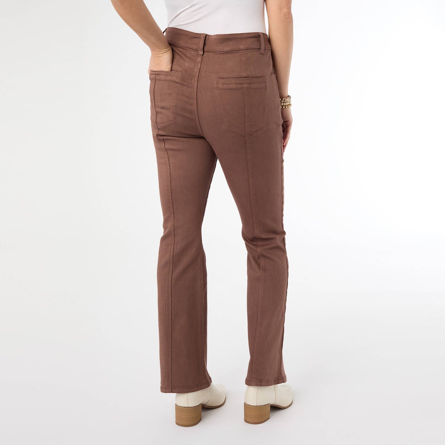 Brown pants worn by a person on a white background