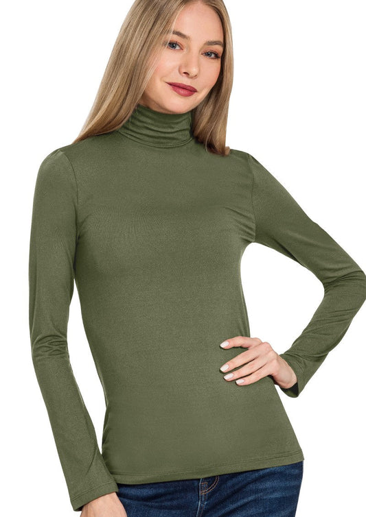 Woman wearing a green turtleneck sweater on a white background