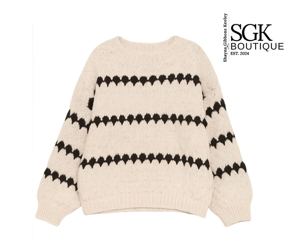 Ivory sweater with black pattern on a white background, featuring SGK Boutique logo.