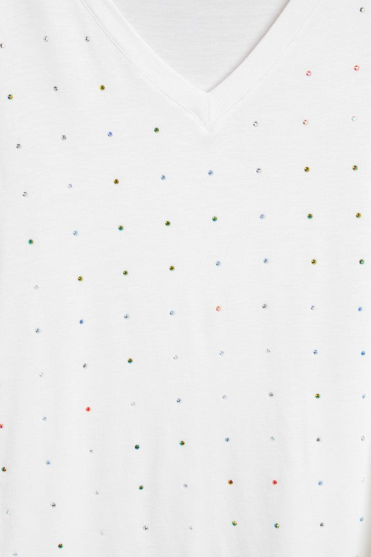 White fabric with multicolored dot pattern