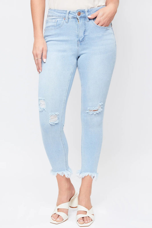 A pair of women's high-rise frayed hem crop jeans with a single-button closure, front zip, and belt loops. The jeans are made of vintage denim with areas of light destruction and frayed detailing at the hem.