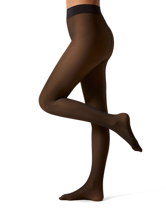 Dark brown tights worn by a person on a white background