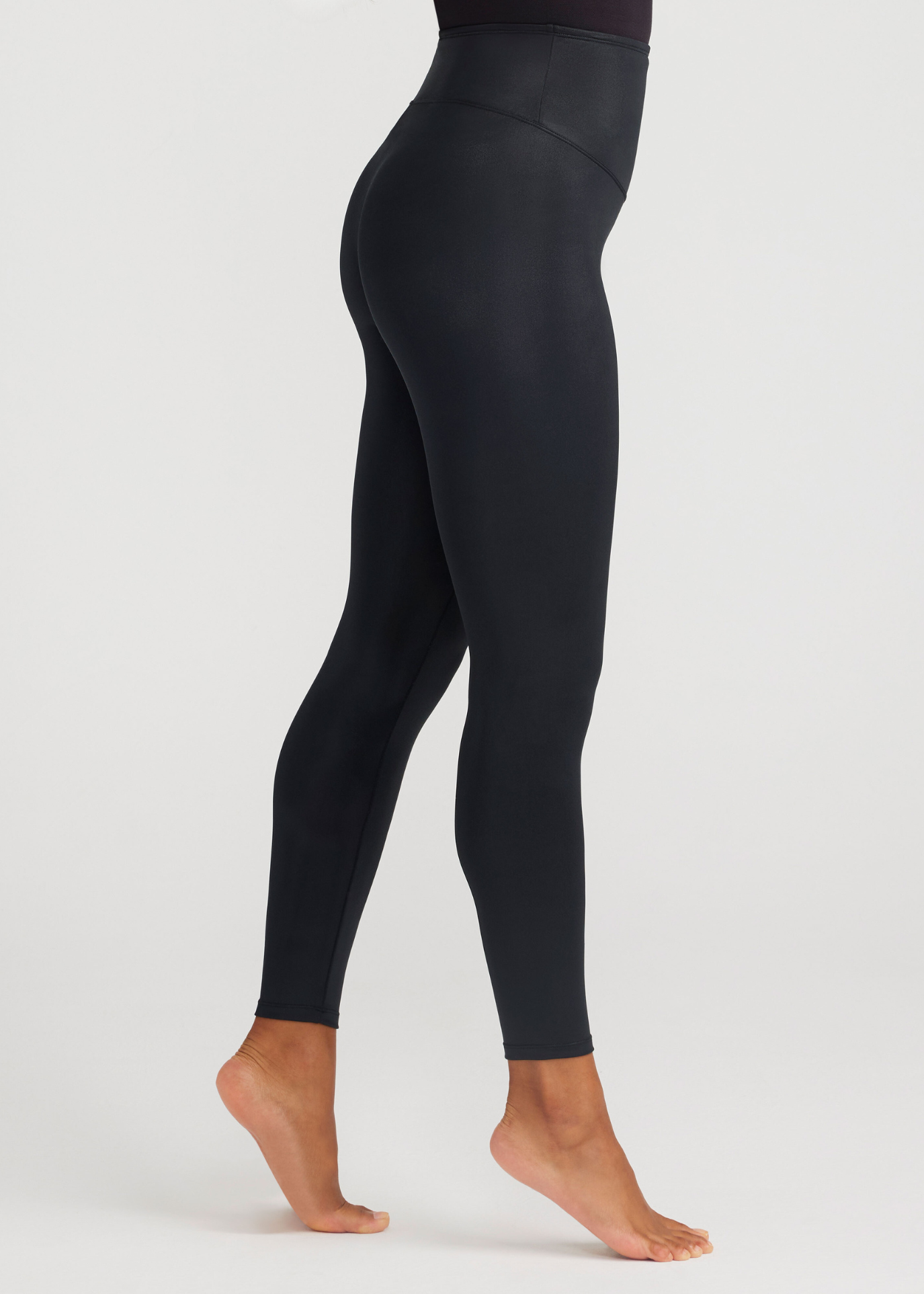 Black leggings worn by a person on a white background