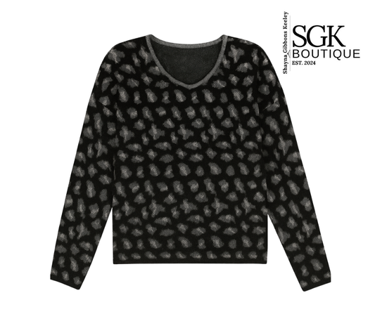 Black patterned sweater on a white background with SGK Boutique logo.
