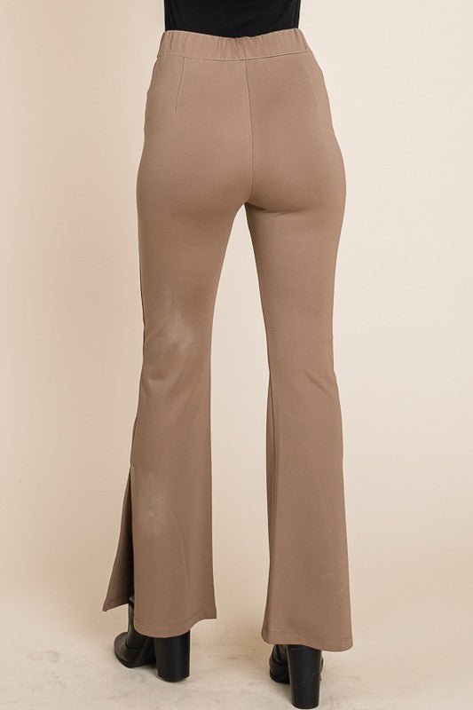 Beige flared pants on a beige background