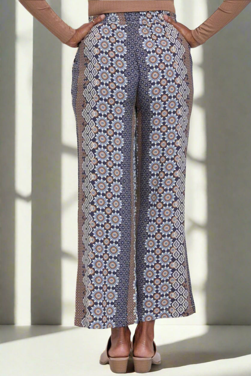 Patterned pants worn by a person on a white background