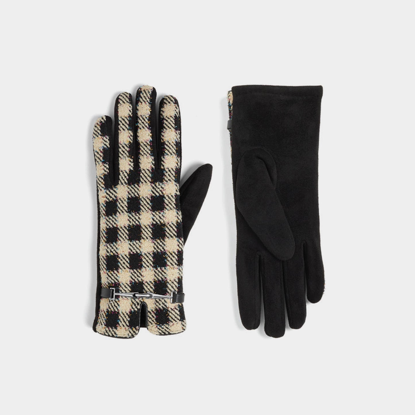 Pair of plaid gloves and a pair of black gloves on a light gray background