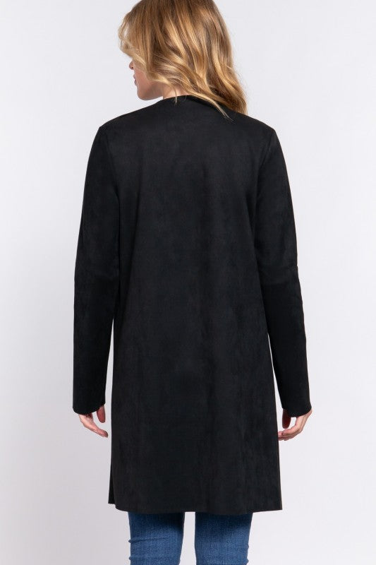 Person wearing a black coat on a white background