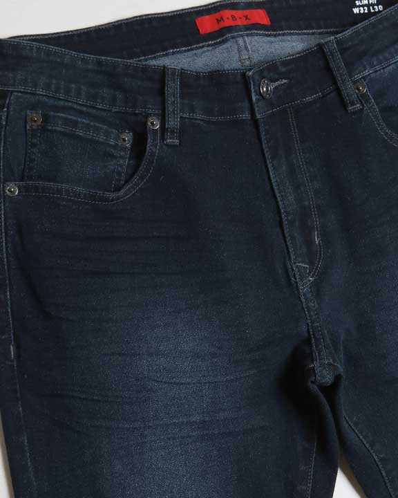 Dark blue jeans with a visible brand label on a light gray background