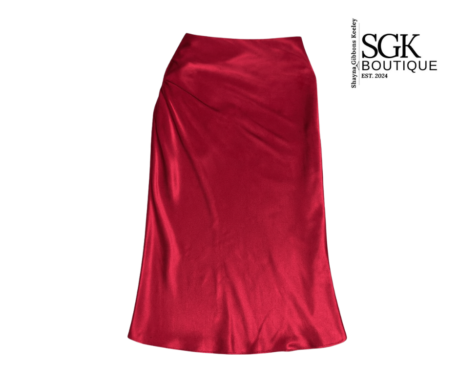 Red satin skirt on a white background with SGK Boutique logo.