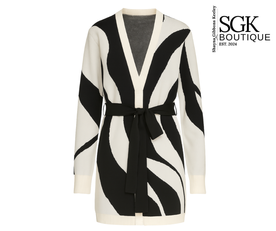 Black and white patterned cardigan with a belt on a white background, featuring SGK Boutique logo.
