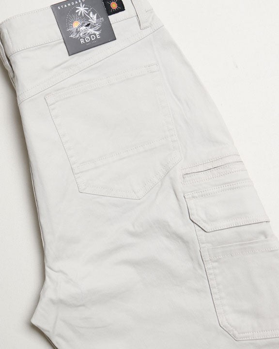 Light gray pants with a brand label on a white background