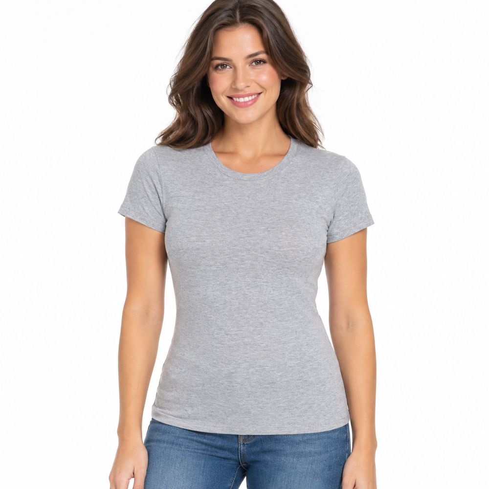 A woman with wavy brown hair wearing a light gray short-sleeve crewneck t-shirt and blue jeans, standing against a solid white background.