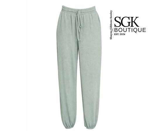 Light gray jade sweatpants on a white background with SGK Boutique branding.