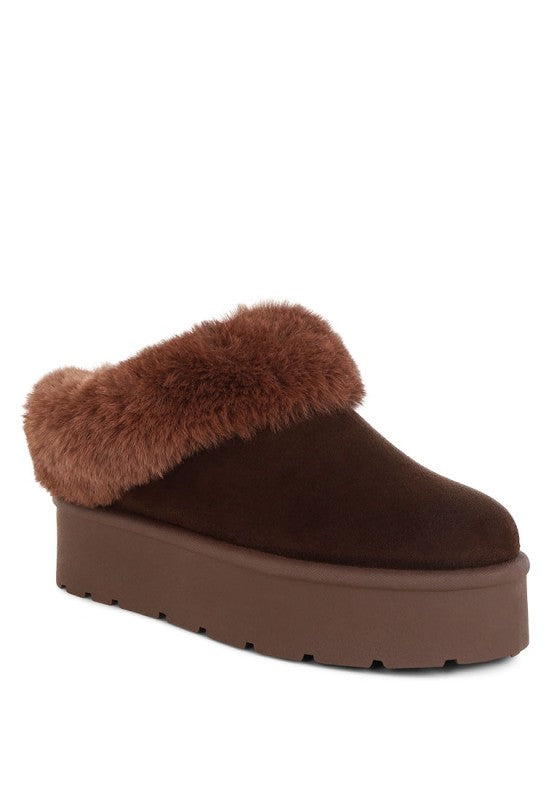 Brown slip-on shoe with fur trim on a white background