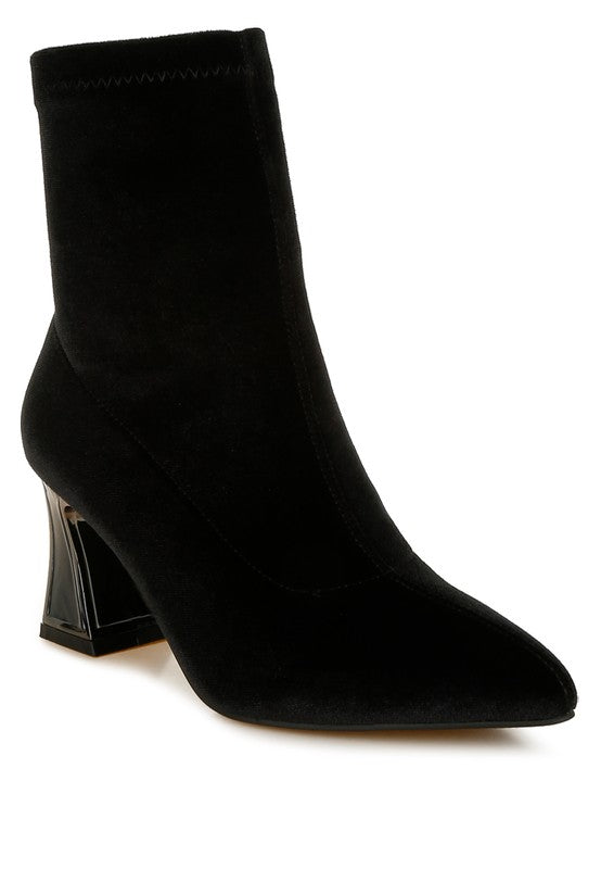 Black ankle boot with a block heel on a white background