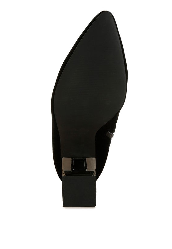 Black pointed-toe shoe on a white background