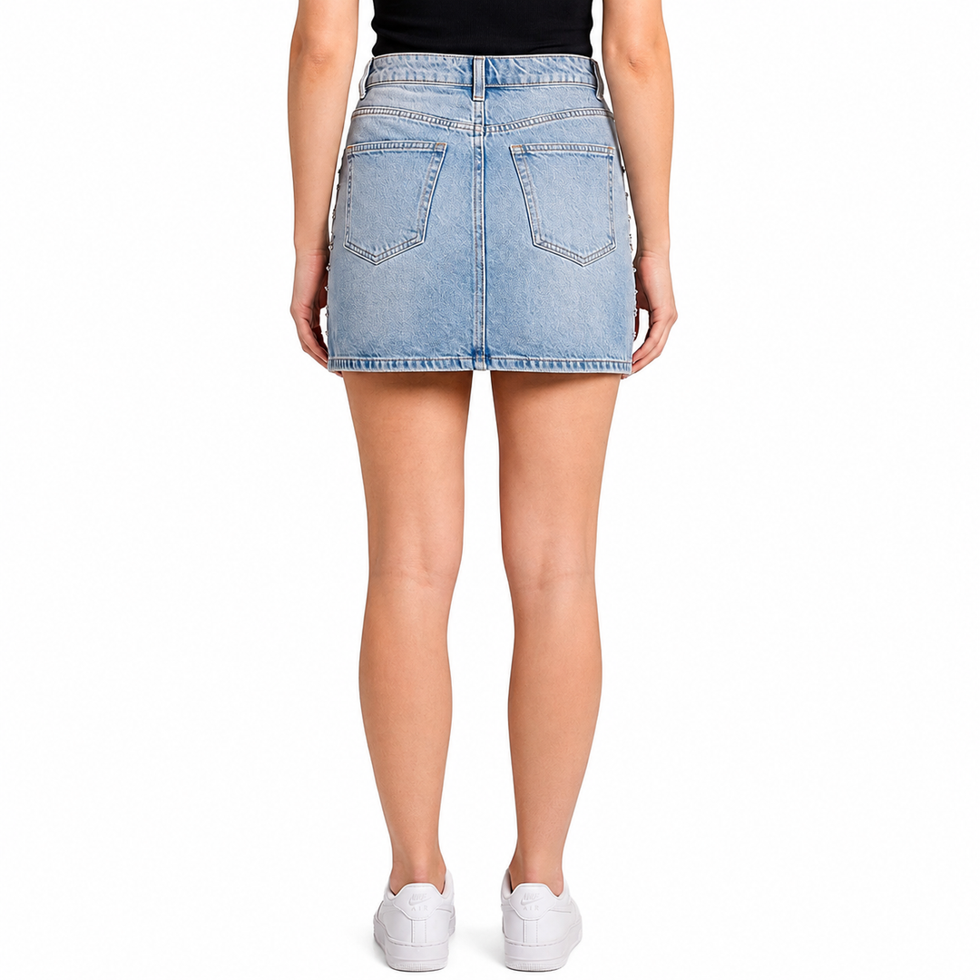 Light blue denim skirt worn by a person on a white background