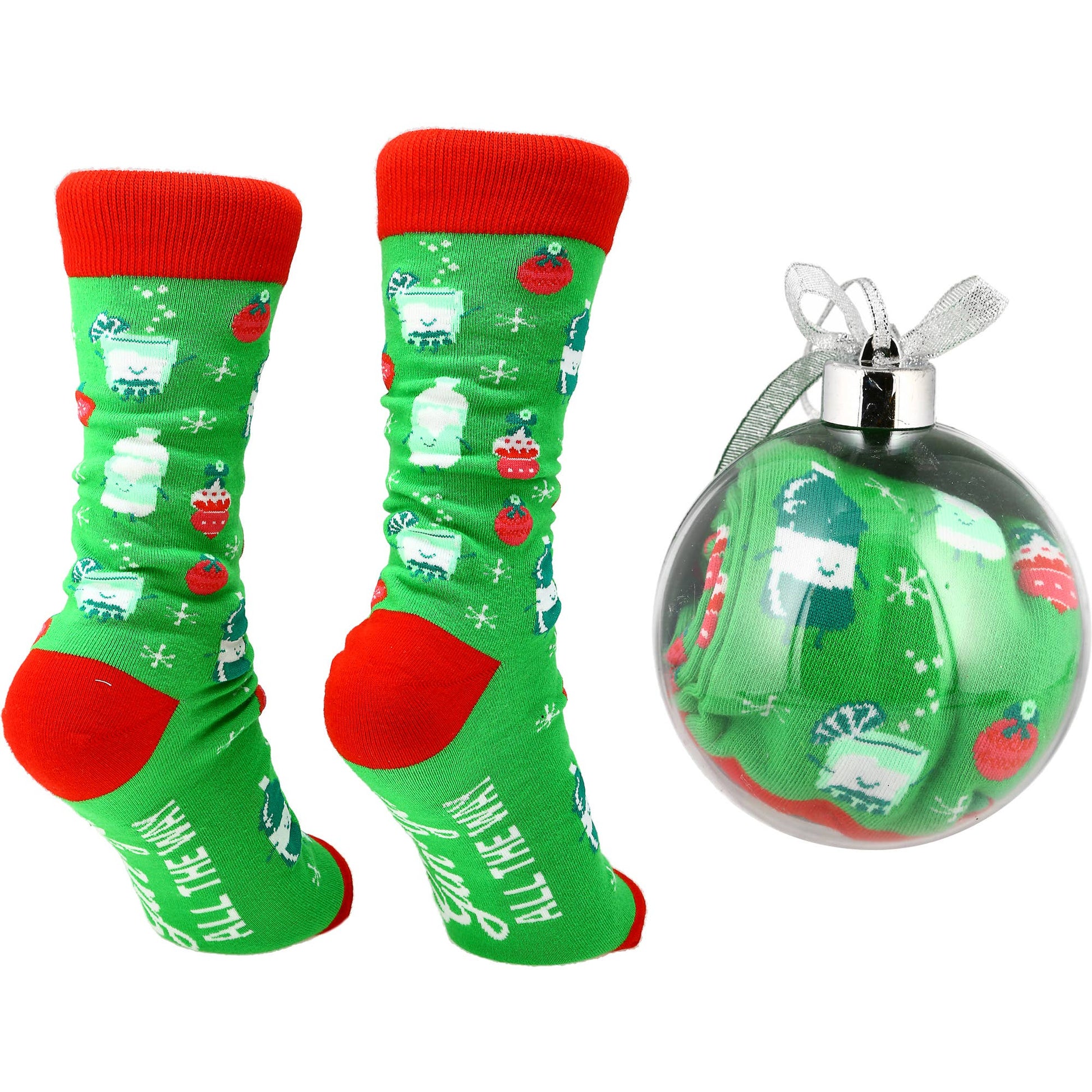 Green socks with red accents and a matching Christmas ornament on a white background