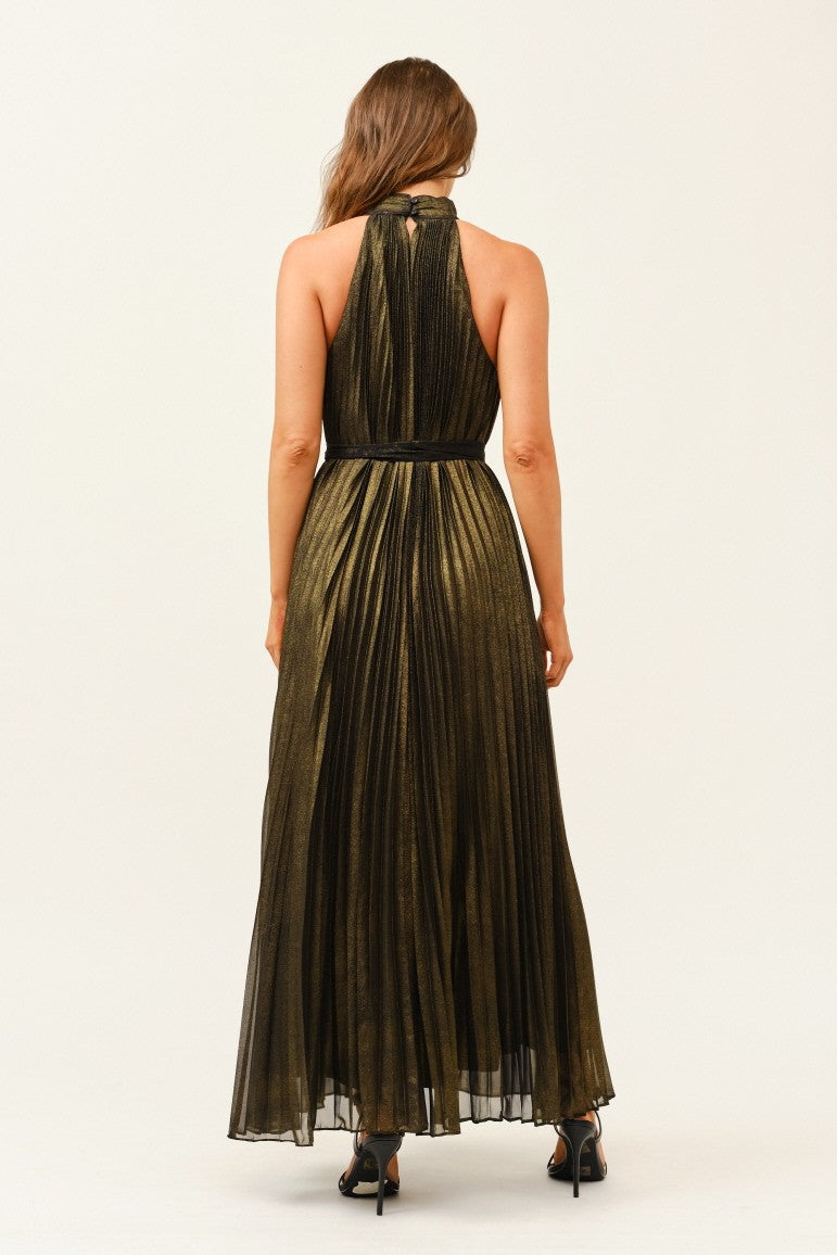 Woman wearing a long green dress with a halter neck on a white background