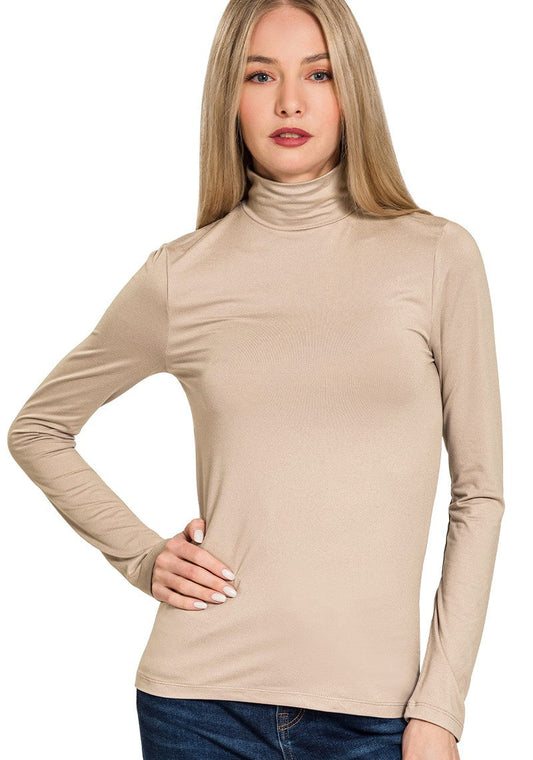 Woman wearing a beige turtleneck shirt on a white background