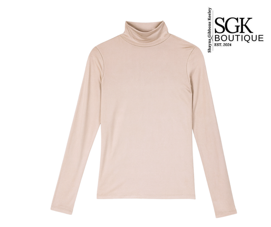 Beige turtleneck sweater on a white background with SGK Boutique logo.