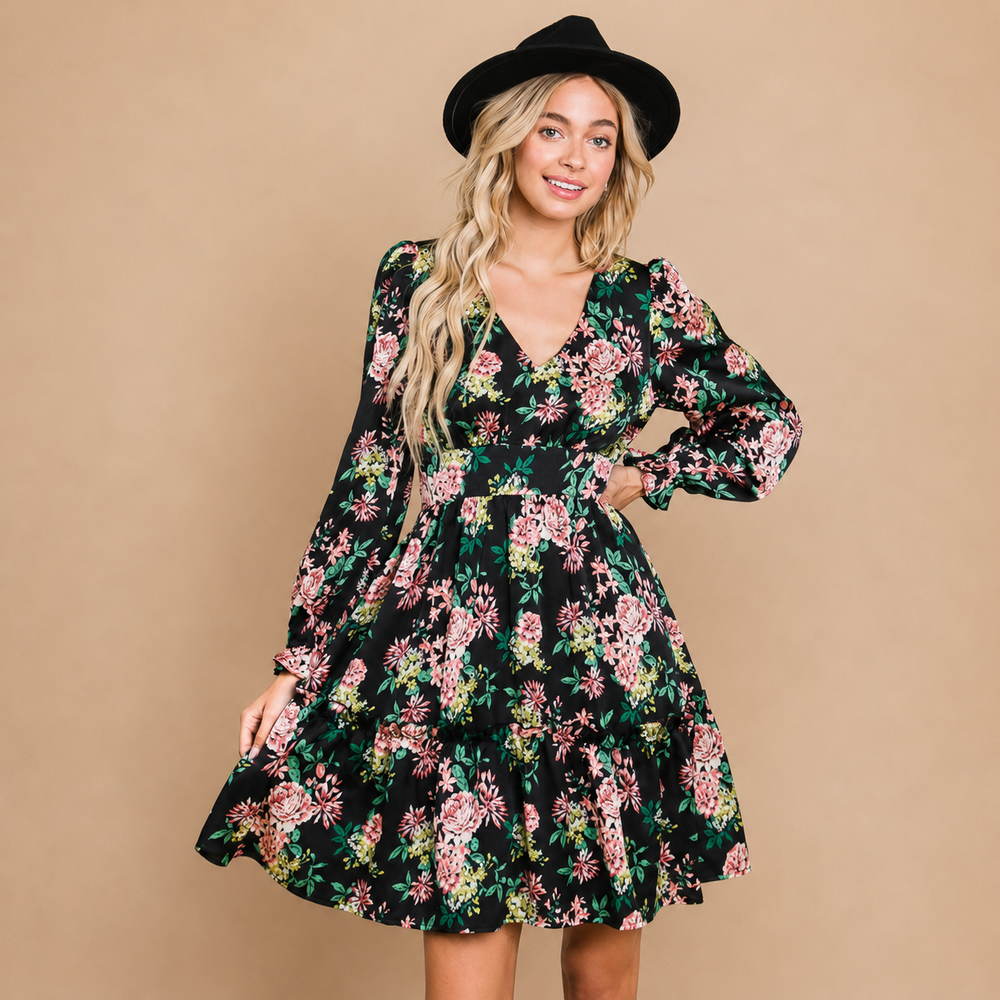 Woman wearing a floral dress and black hat against a beige background