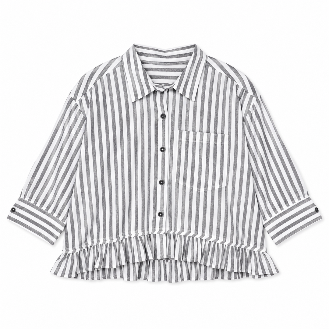A long-sleeve button-up shirt with vertical ash black and white stripes, featuring a pointed collar, a chest pocket, and a ruffled hem, shown on a plain white background.