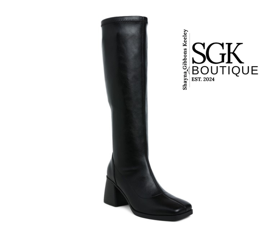 Black knee-high boot on a white background with SGK Boutique logo.