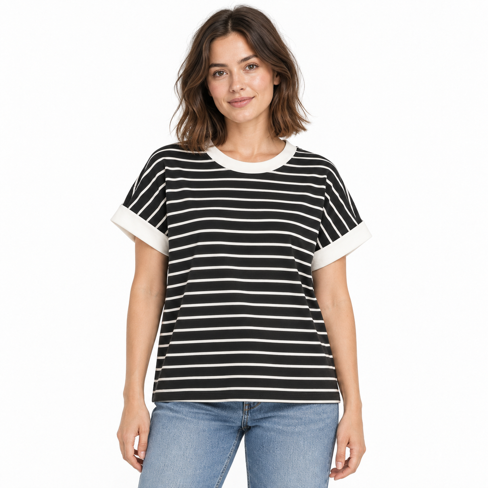 A woman modeling a black and white horizontally striped short-sleeve t-shirt with white ribbed trim on the crew neck and cuffs, paired with blue jeans against a plain white background.