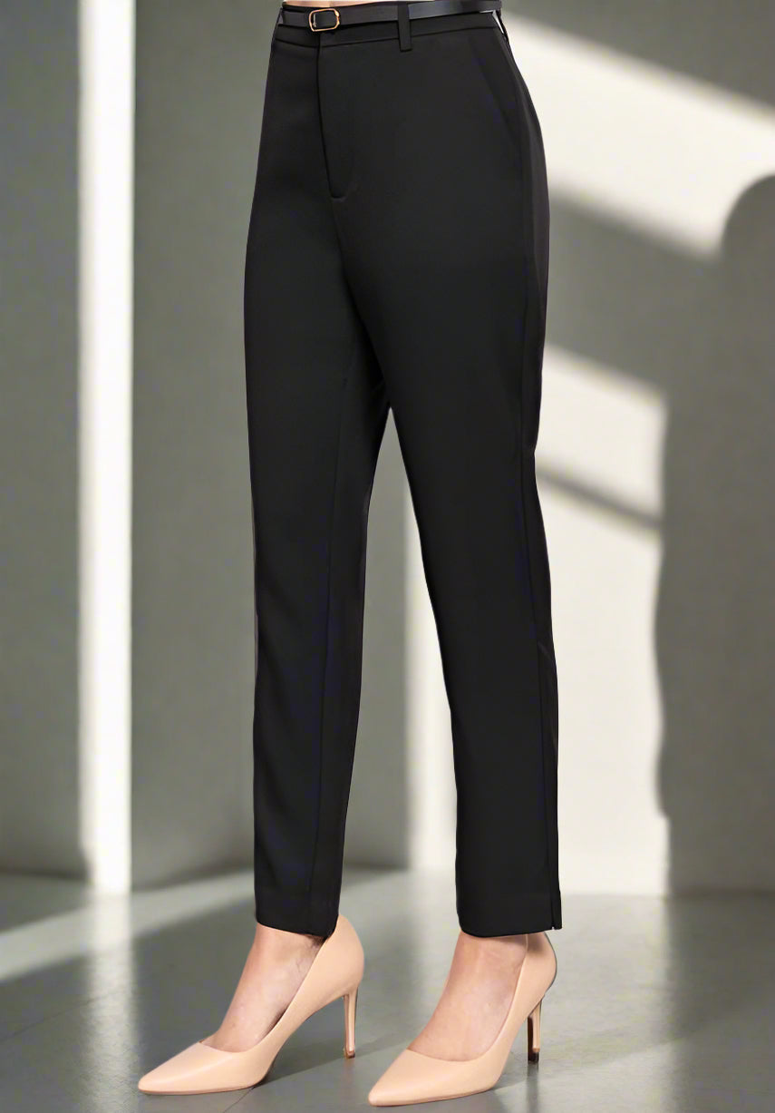 Black pants worn by a person on a light gray background