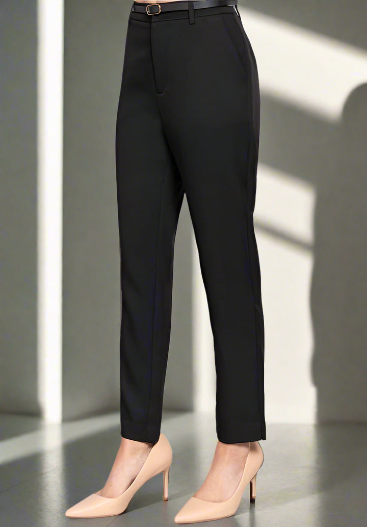 Black pants worn by a person on a light gray background