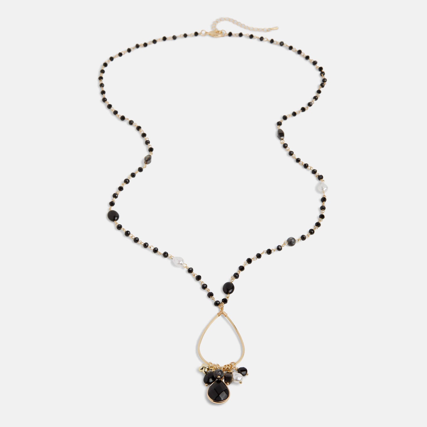 Necklace with black beads and a teardrop pendant on a white background
